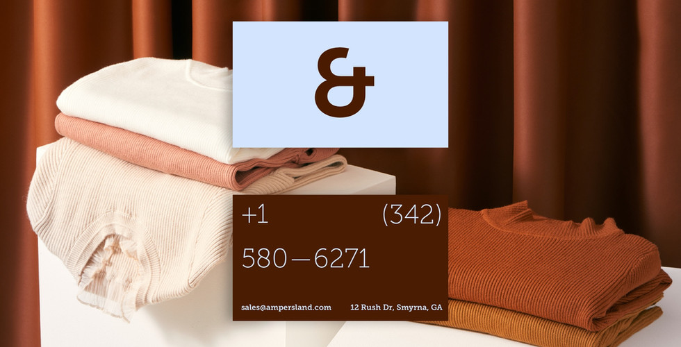 The front and back of a business card for a brand with a logo resembling an ampersand is laid over an image of folder winter shirts in brown and white shades. The business card is light blue on the front and brown on the back.