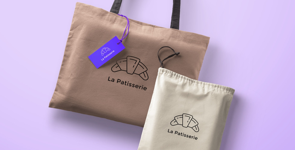 Brown fashion bags branded with the logo for "La Patisserie" laid over a lavender background.
