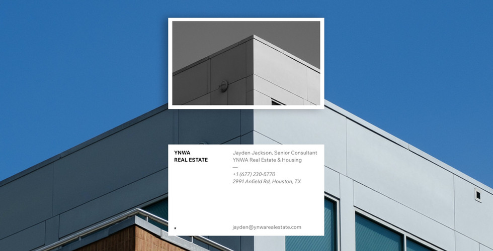A white business card for a company called "YNWA Real Estate" over a background image of a gray building. The back of the card shows part of the building image.